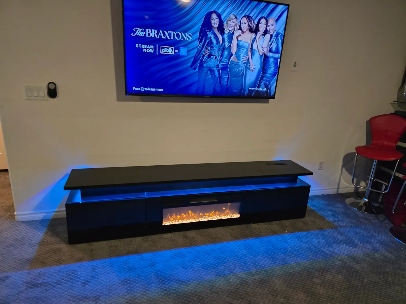 Freestanding Electric Fireplace TV Stand With Adjustable LED Entertainment Center project photo by Mr. B Handyman Services in Las Vegas